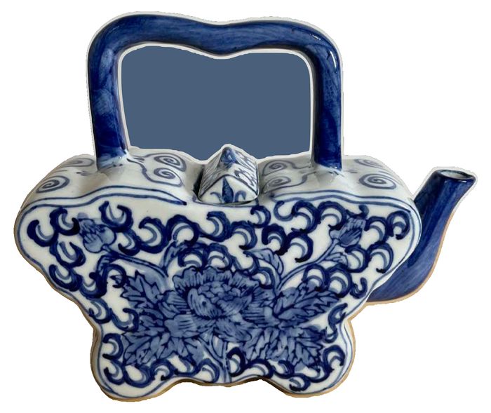 Vintage blue and white porcelain teapot in a butterfly shape